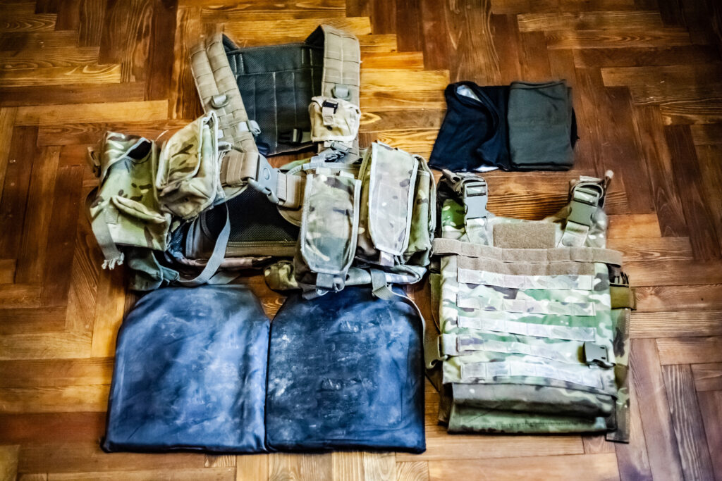 military body armor displayed on a table