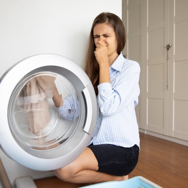 Clean your washing machine to remove odor